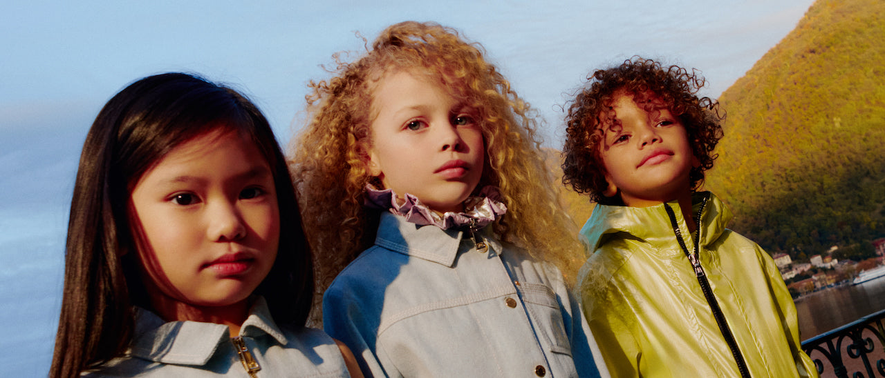 three GIRLS in moncler jackets marketing the new arrivals page for spring summer 2024 for kids atelier