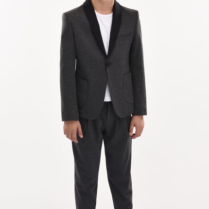 Boy wearing black suit linked to moustache collection page