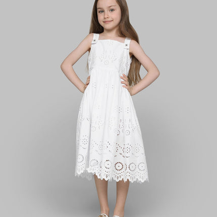 Girl wearing dress clothing from kids atelier posing in desert promoting end of season sale 