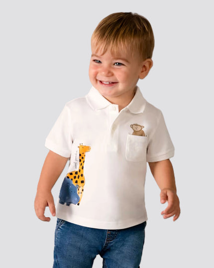 boy wearing baby clothing from kids atelier posing in desert promoting end of season sale 