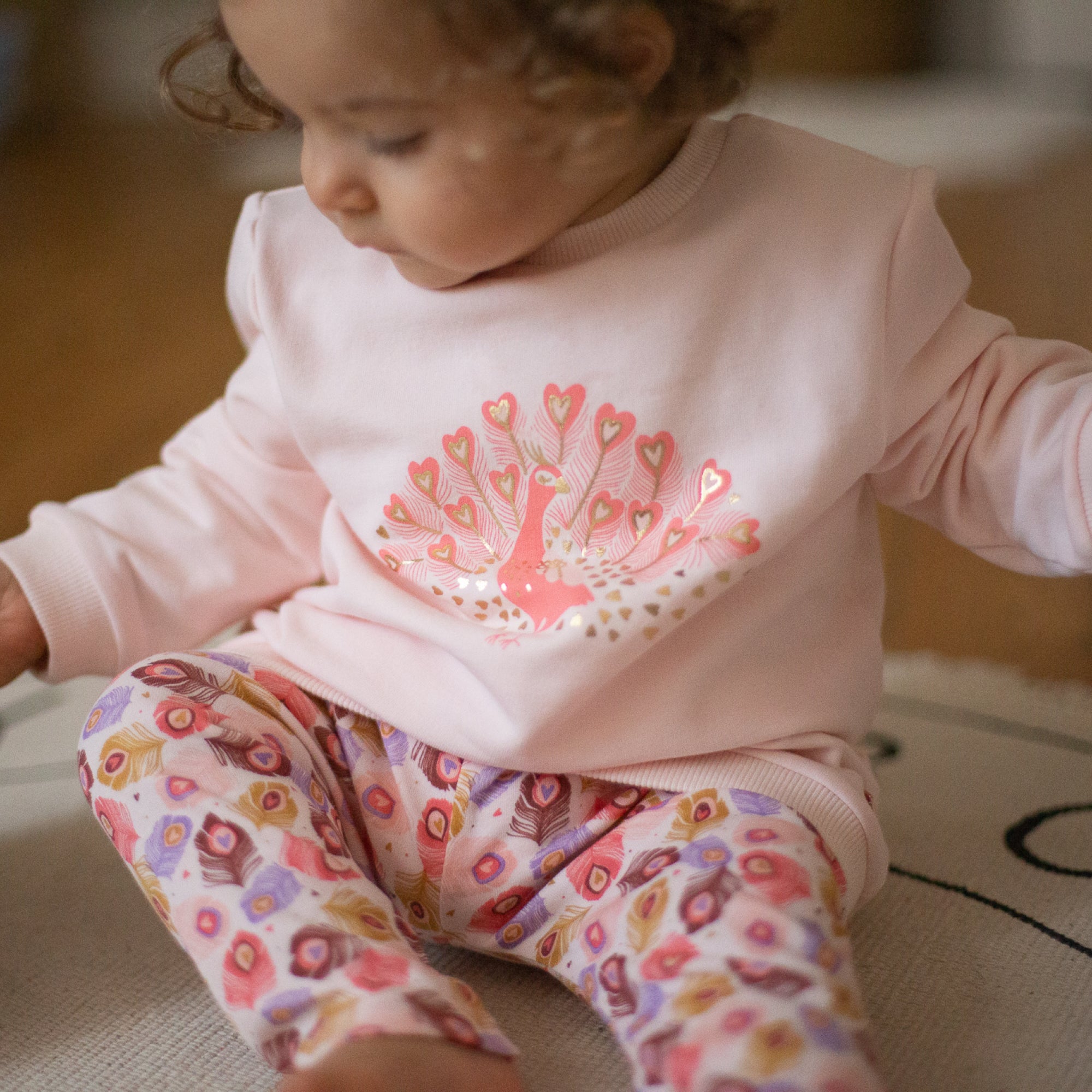 Apricot peacock clearance top